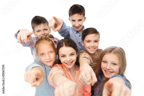 happy children pointing finger to you