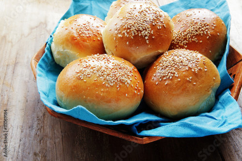 The burger buns on wooden background