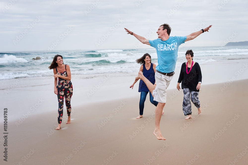 Family being playful together on the beach Family being playful together on the beach