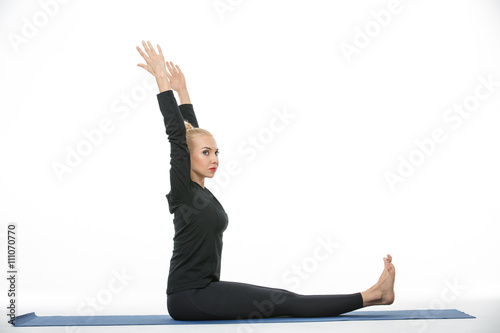 Fototapeta Naklejka Na Ścianę i Meble -  Gymnast girl does exercise