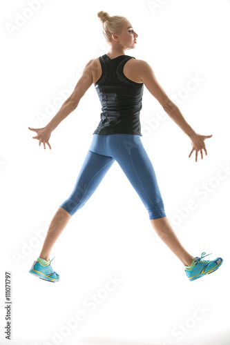 Jumping girl in sportswear