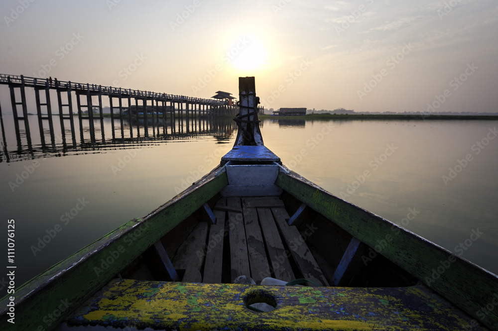 Wooden boat in Ubein Bridge at sunrise, Mandalay, Myanmar (World