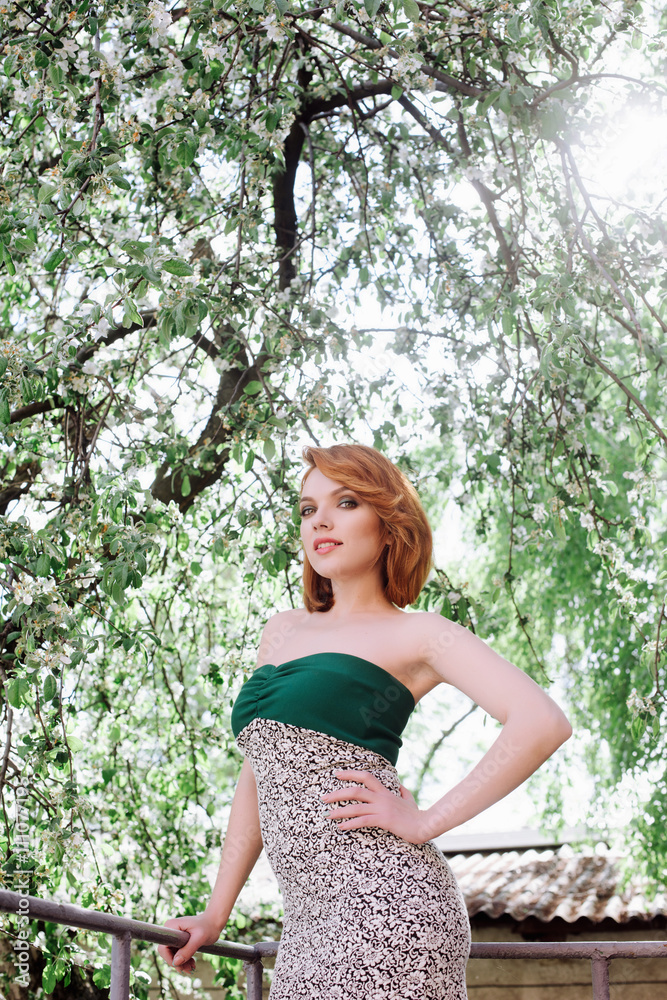 Portrait of a beautiful woman with red hair on the nature Portrait of a beautiful woman with red hair on the nature