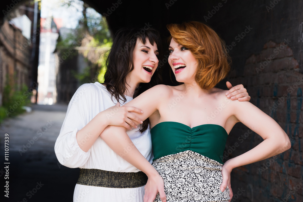 Two beautiful women talking, laughing, chatting, friendship, lifestyle Two beautiful women talking, laughing, chatting, friendship, lifestyle