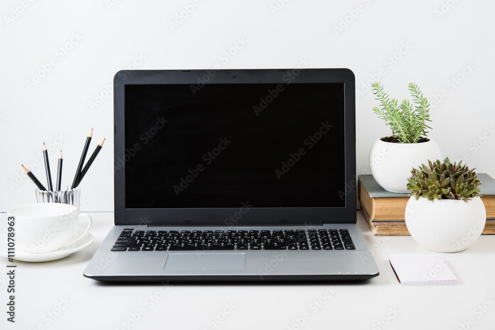 Fototapeta premium modern work space with laptop mockup on a table