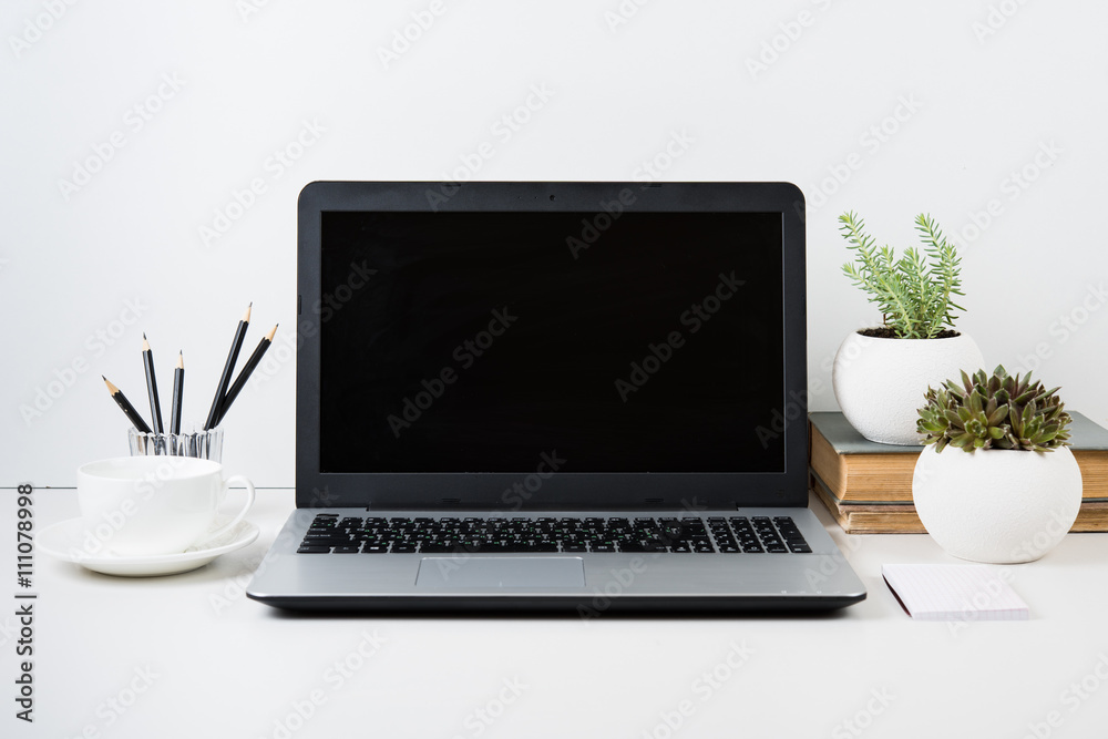 Fototapeta premium modern work space with laptop mockup on a table