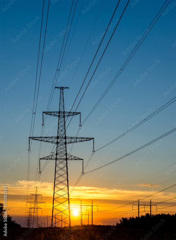  electric pylon with power line at sunset