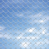 Wire Fence Against Sky