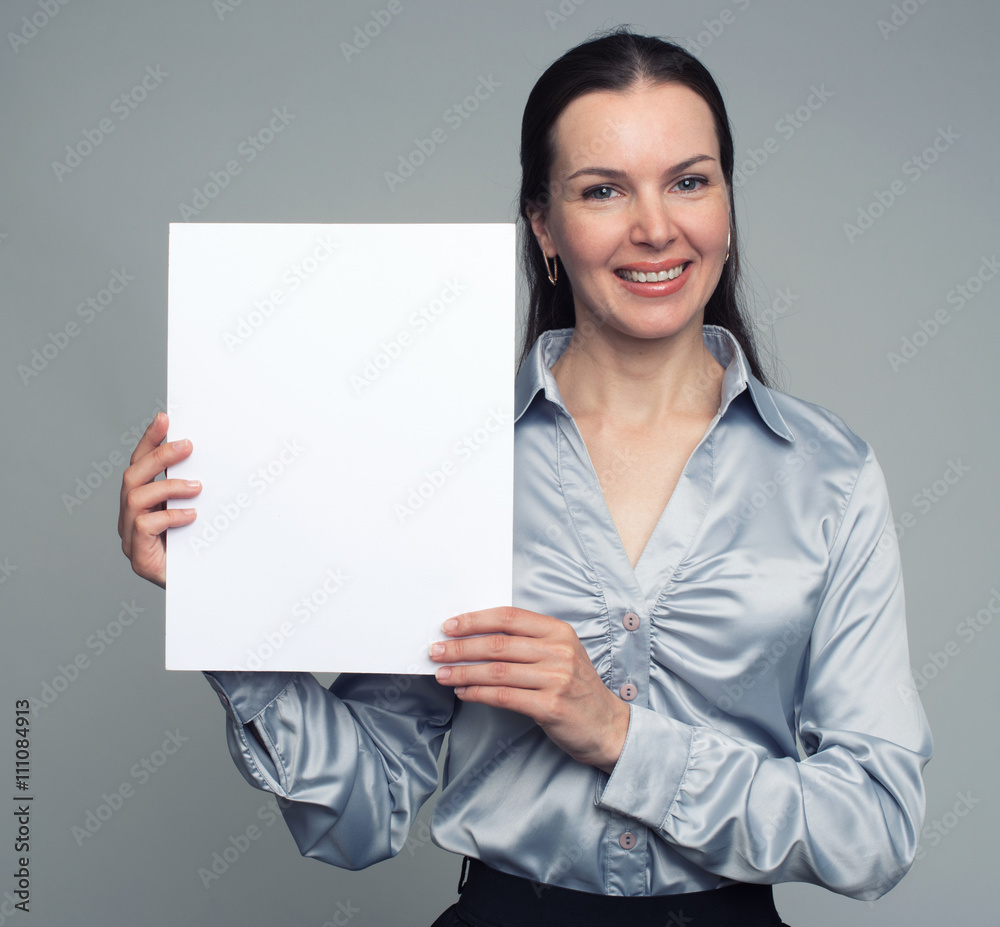 Smiling woman holding blank card Smiling woman holding blank card