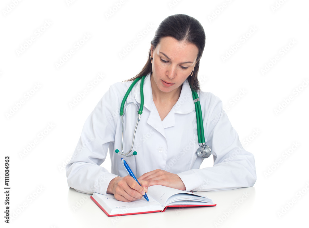 Female doctor takes notes in her notebook Female doctor takes notes in her notebook