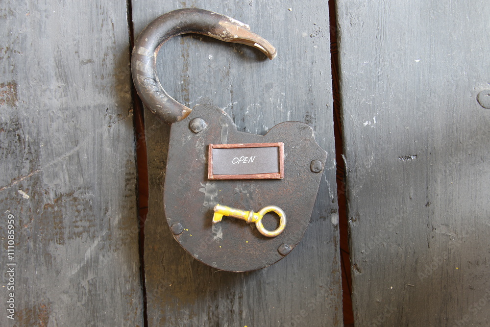 Open sign and old padlock 