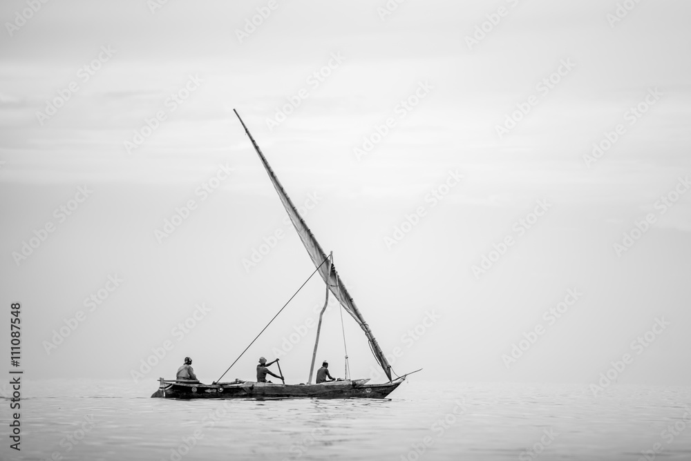 Traditional African boat sailing on calm ocean