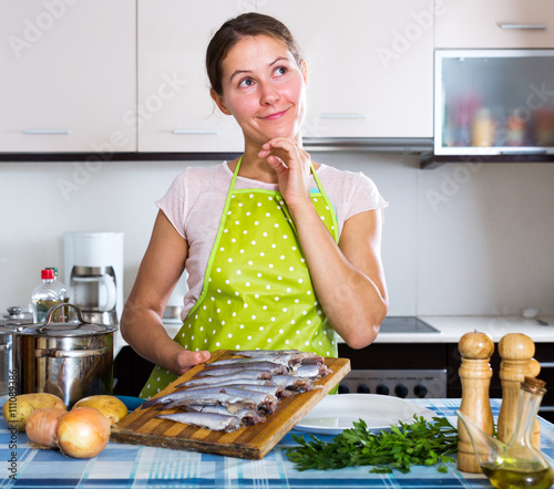 Happy housewife trying new recipe photo