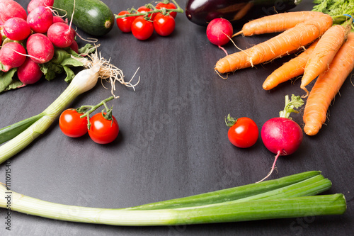 Fresh Vegetables on Black Stone surface background with empty space  