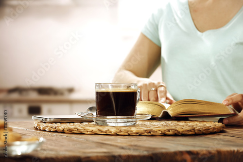 woman with coffee and book 