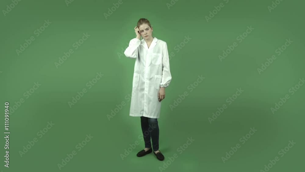 attractive caucasian girl with lab coat isolated on green thinking scratching head attractive caucasian girl with lab coat isolated on green thinking scratching head