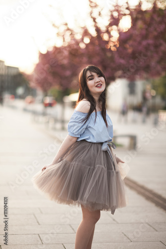 Young Asians girl with modern dress posing in an old Krakow