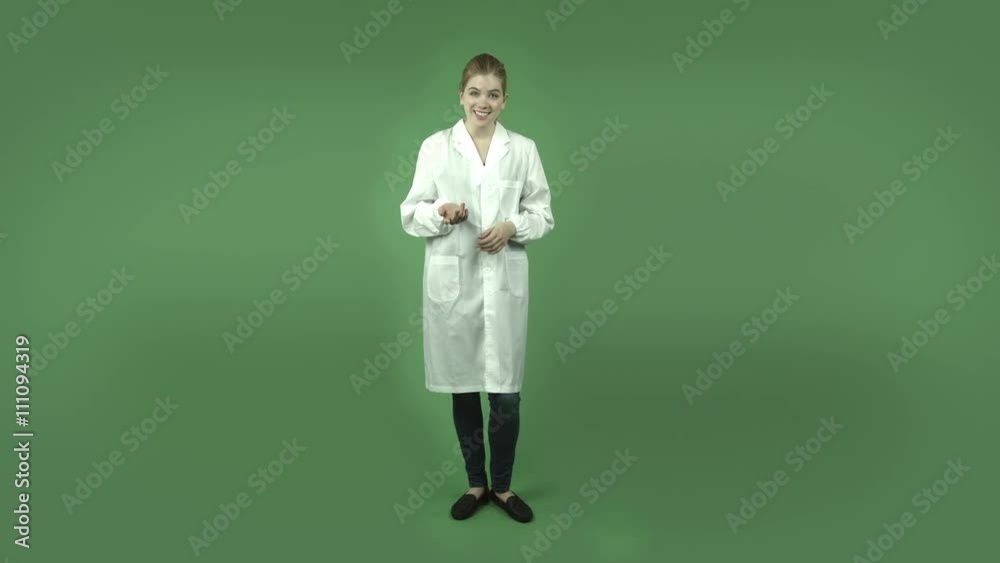 attractive caucasian girl with lab coat isolated on green talking