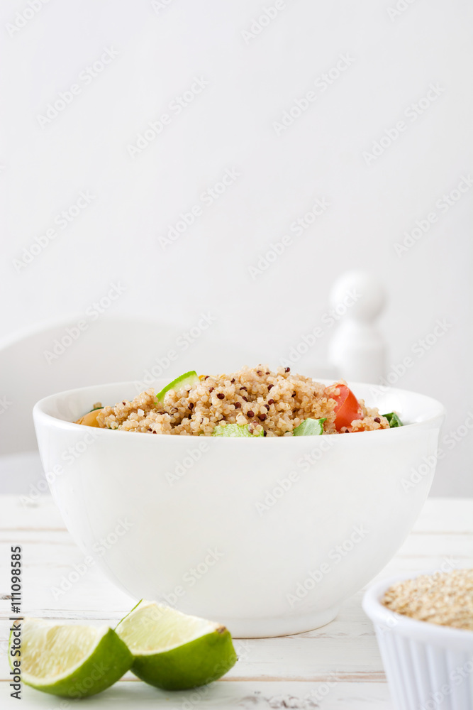 Quinoa salad in bowl on white wooden table
Quinoa salad in bowl on white wooden table