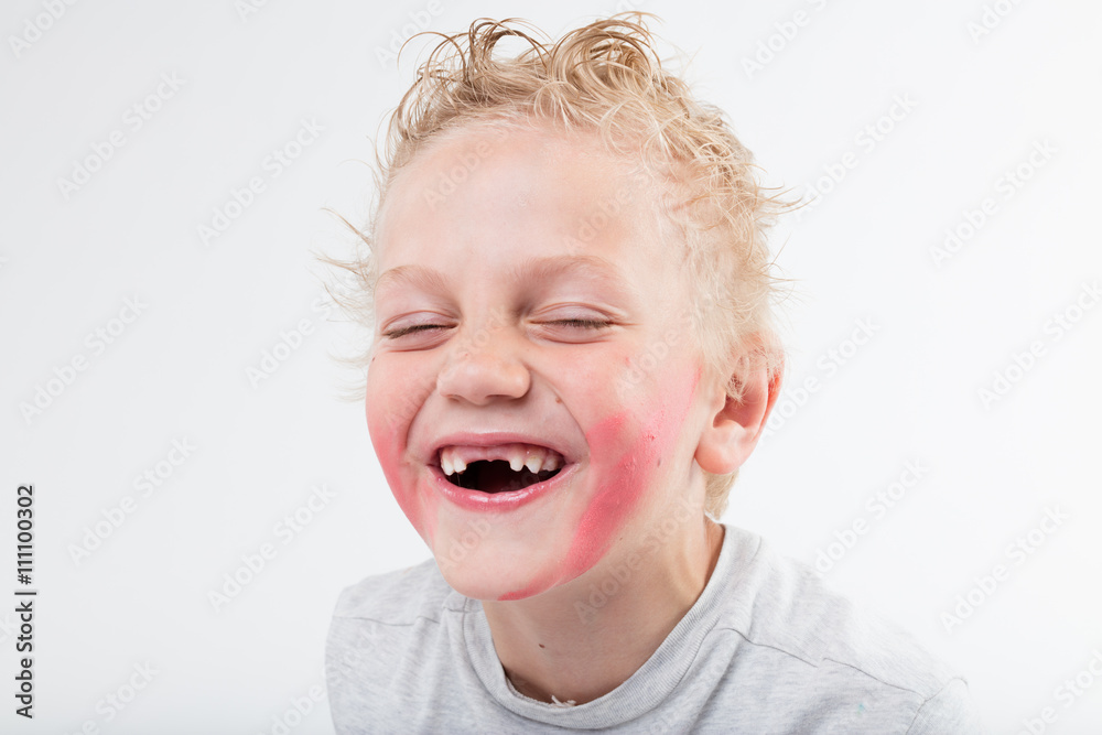 kid baring his windowed teeth laughing kid baring his windowed teeth laughing