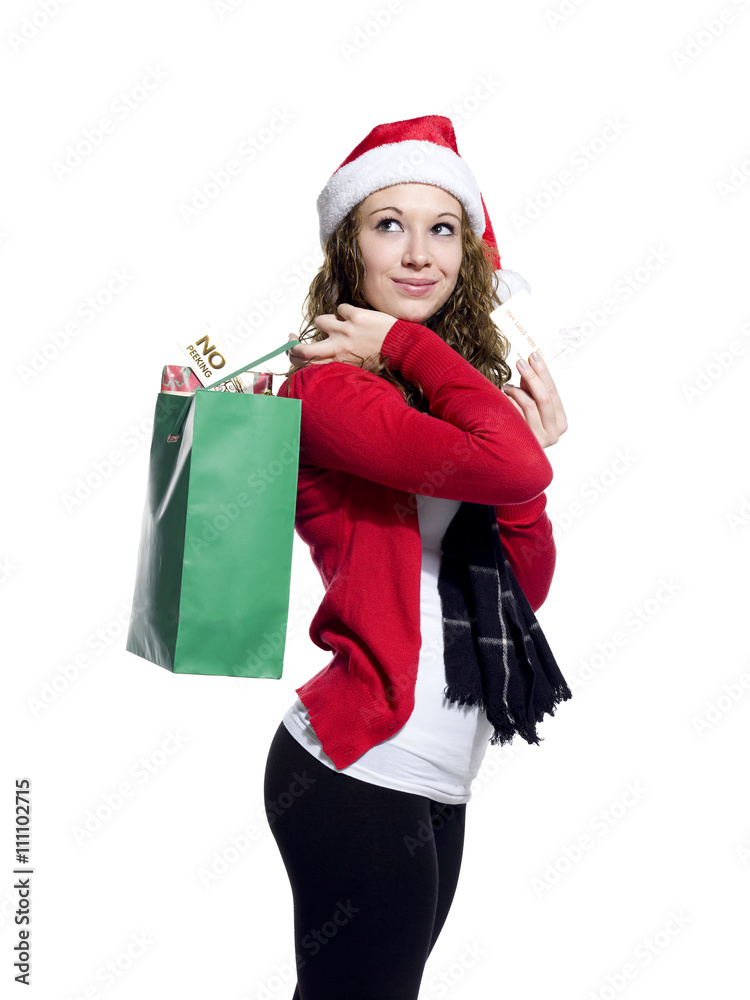 smiling young woman with shopping bags looking away.