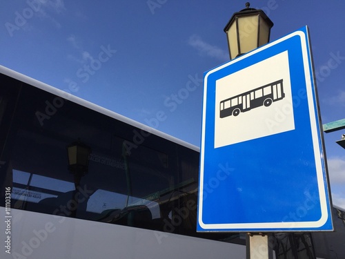 public bus station signpost with bus. photo