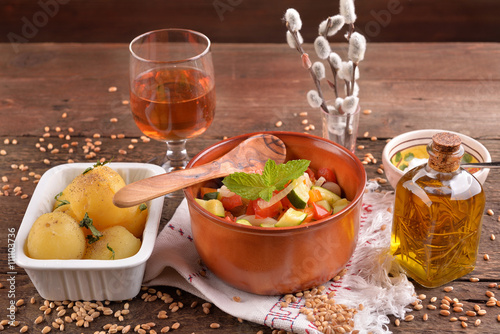 terracotta bowl with pasta and vegetables