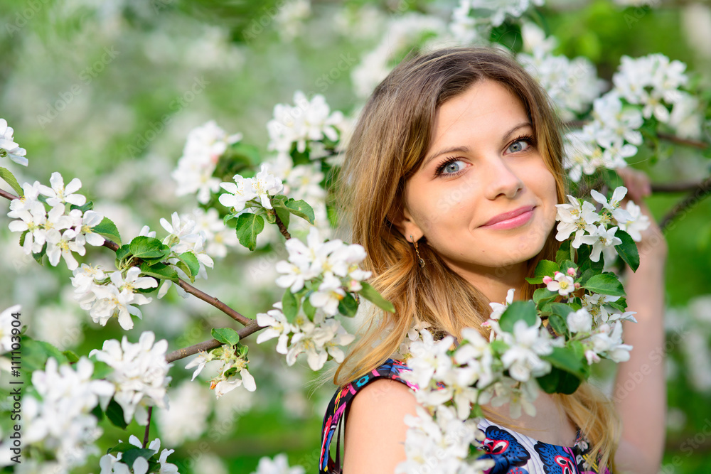 Beautiful woman in blooming garden Beautiful woman in blooming garden
