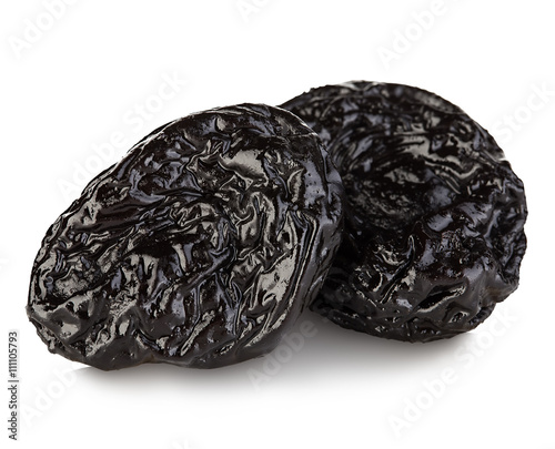 Raw organic prunes, dried plums, smoked prunes close-up on a white background.