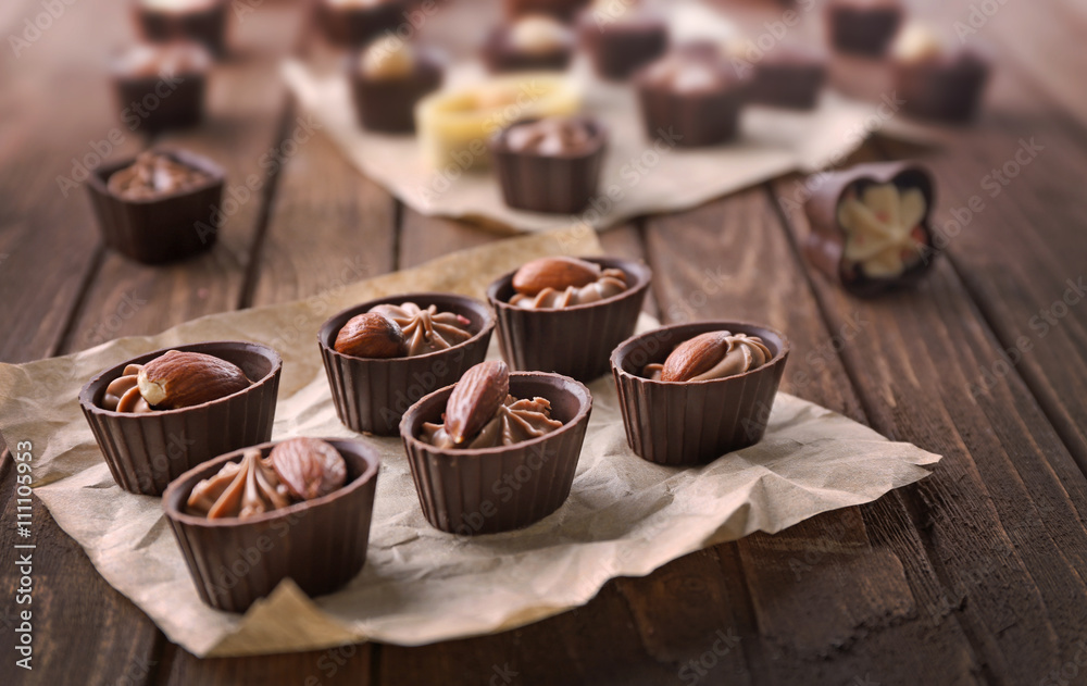 Chocolate sweets on wooden background Chocolate sweets on wooden background