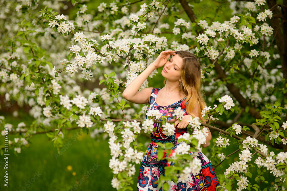 Beautiful woman in blooming garden Beautiful woman in blooming garden