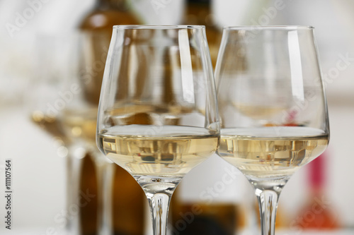 Glasses of white wine closeup photo