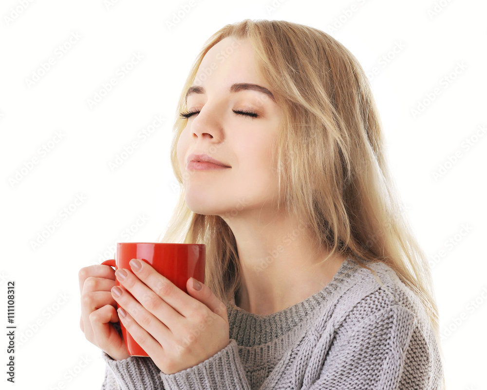 Beautiful girl enjoying a cup of tea, isolated on white