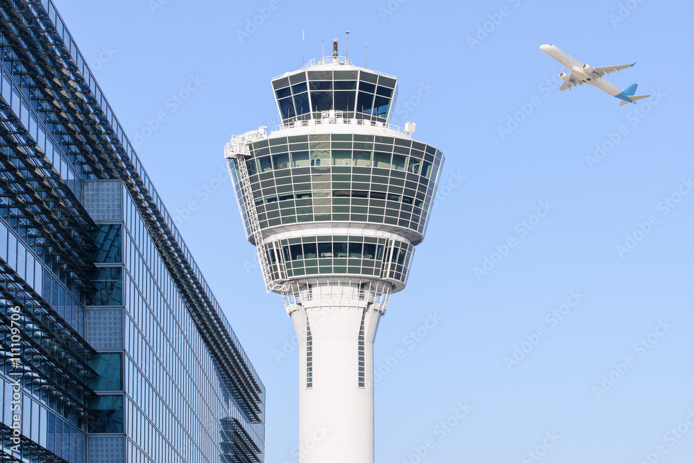 Fototapeta premium Munich international airport control tower and departing taking off