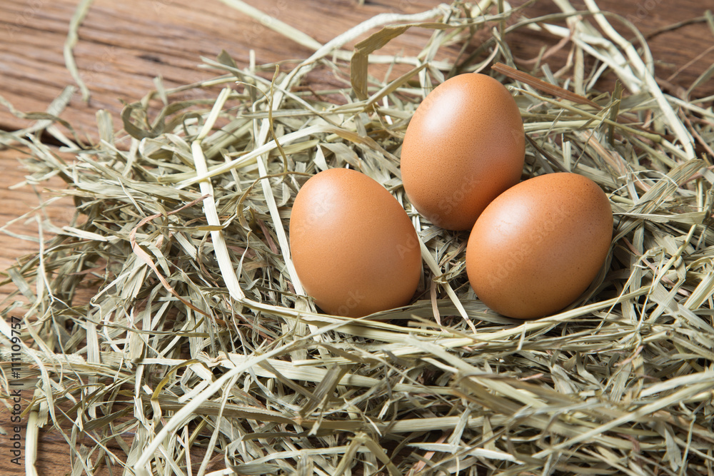 Eggs On Straw And Wood Background Raw Fresh Natural Farm Chicken