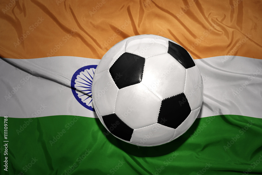 Fototapeta premium black and white football ball on the national flag of india