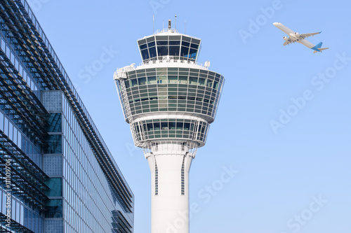 Munich international airport control tower and departing taking off photo