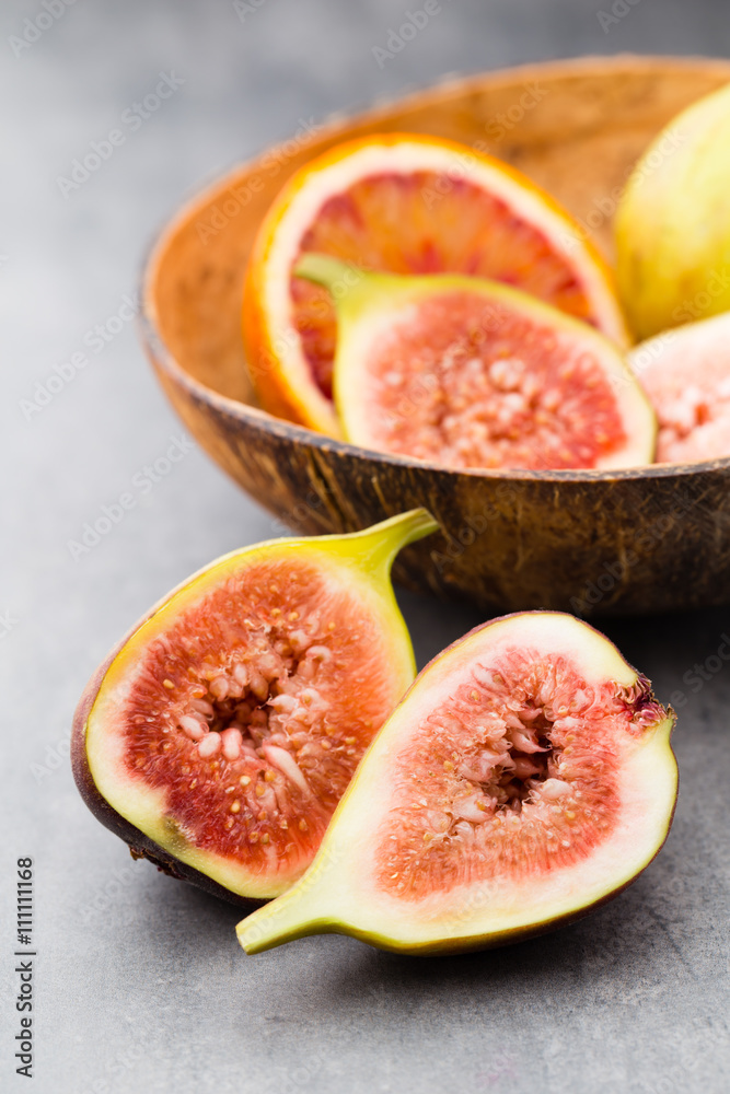 Bloody Sicilian oranges and figs. Shallow depth of field. Bloody Sicilian oranges and figs. Shallow depth of field.