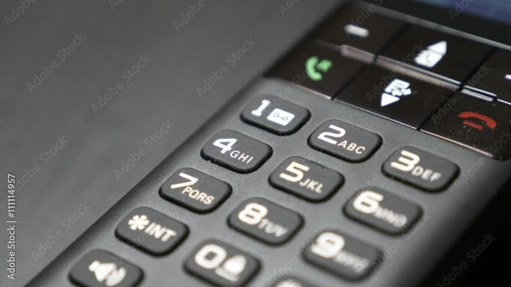 Contemporary land line telephone keyboard and keys on table 4K 2160p 30fps UltraHD video - Standby and energy saving option of phone in office 4K 3840X2160 UHD footage Contemporary land line telephone keyboard and keys on table 4K 2160p 30fps UltraHD video - Standby and energy saving option of phone in office 4K 3840X2160 UHD footage