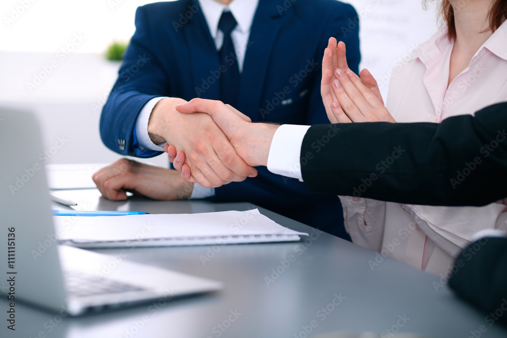 Business people shaking hands finishing up a meeting