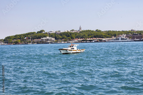 Fishing boat in front of Topkapi Palace in Istanbul © theendup