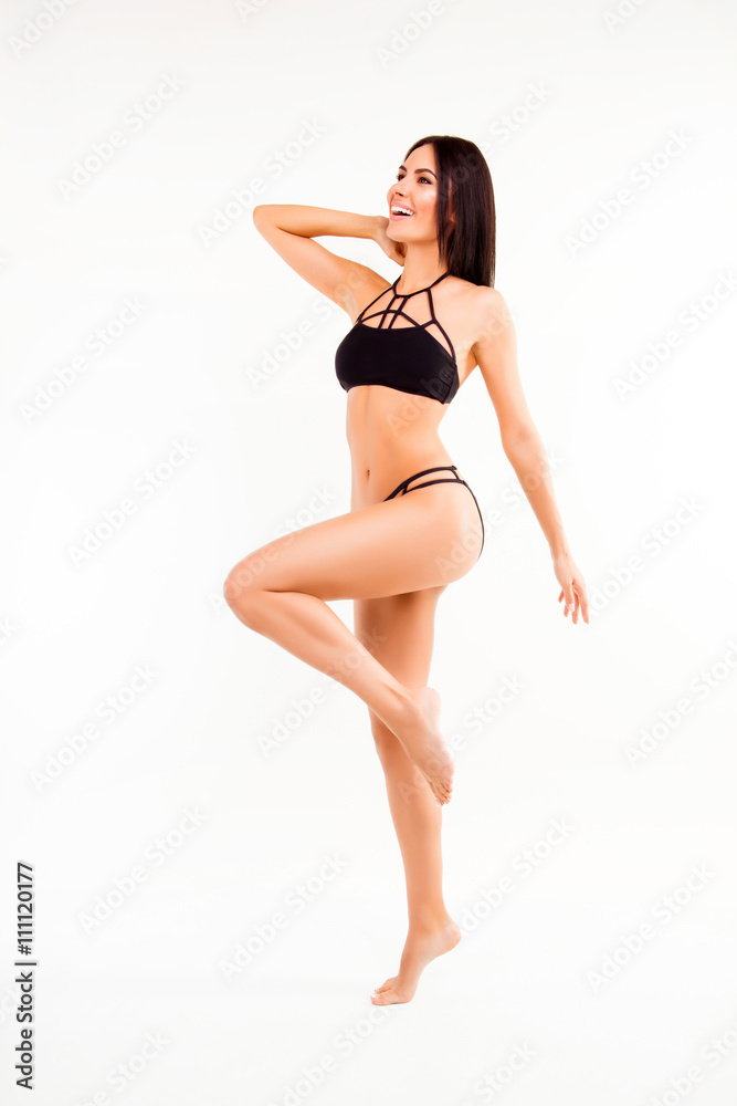 Cheerful slim fit woman in lingerie doing exercises