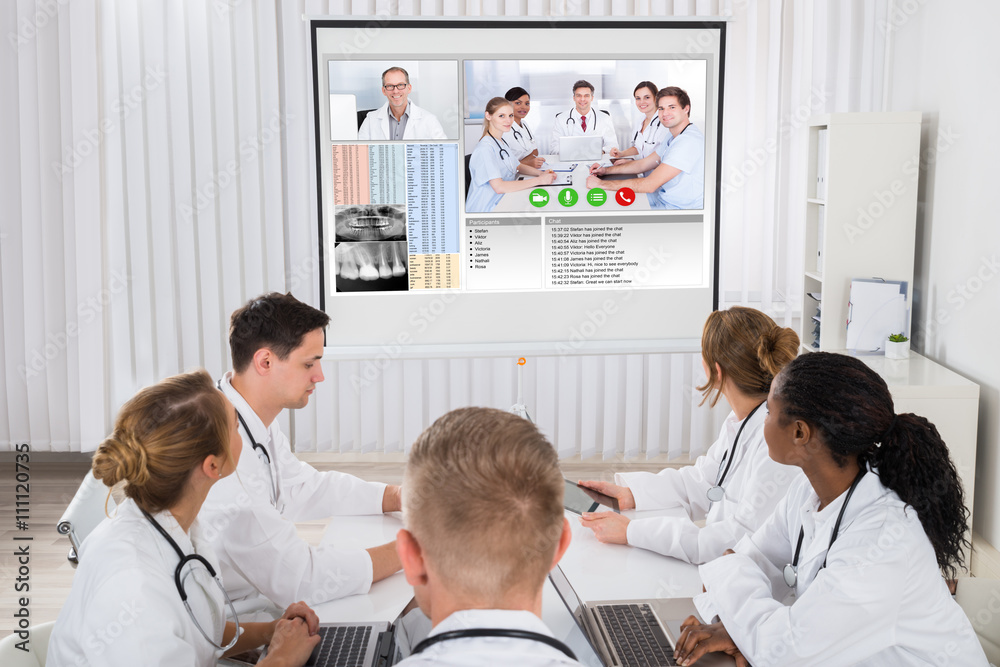 Fototapeta premium Doctors Videoconferencing With Male Doctor