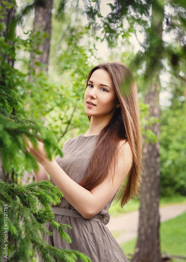 Naklejka premium young, beautiful, sexy woman in park on walk