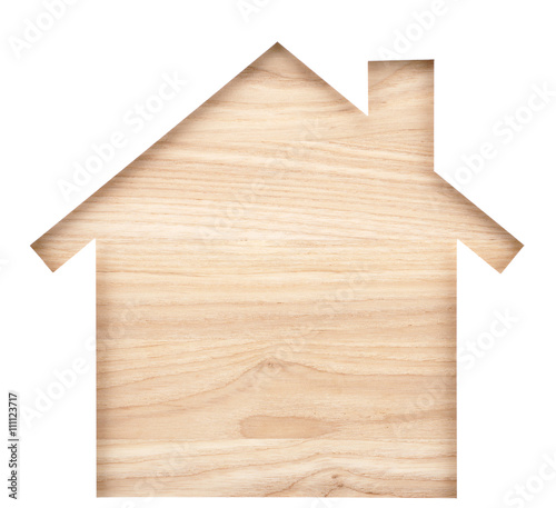 House shaped paper cutout on natural wood lumber. Isolated on white background. 