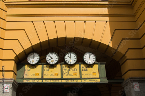 Station clocks at the main entrance of Flinders Street Railway Station in Melbourne Victoria, Australia.  Flinders Street railway station serves the entire metropolitan rail network. photo