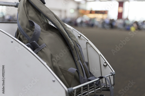 rucksack on cart in airport terminal building