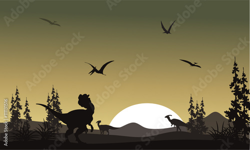 Silhouette of dilophosaurus in park