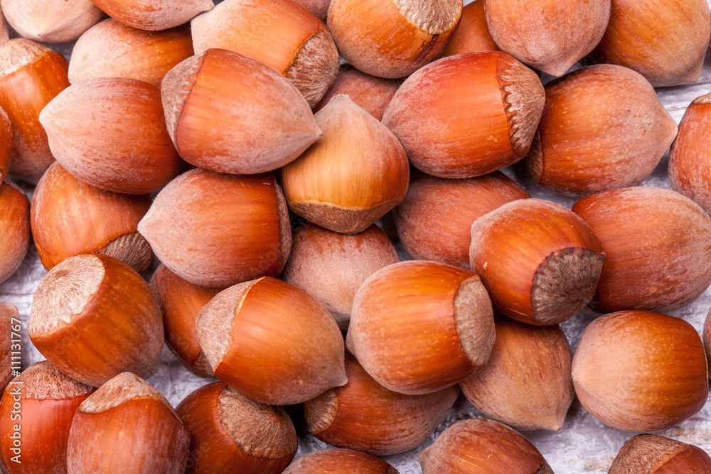 Nuts on wooden background in close up photo Nuts on wooden background in close up photo
