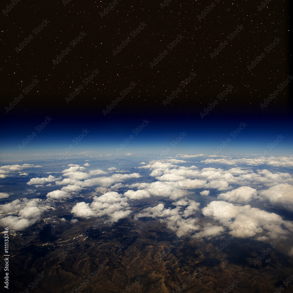 Aerial view of Earth in space with stars. The desert in the western United States. Aerial view of Earth in space with stars. The desert in the western United States.